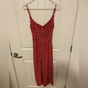 Red With White Flowers Jumpsuit. Size Small. Button Closure in the back. Capri